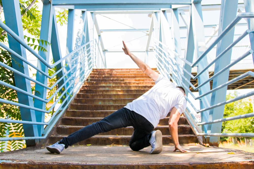 rear-view-man-dancing-stairway